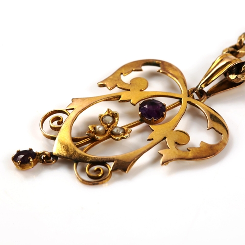 345 - An Edwardian Art Nouveau 9ct gold amethyst and pearl openwork pendant necklace, on gold plated facet... 