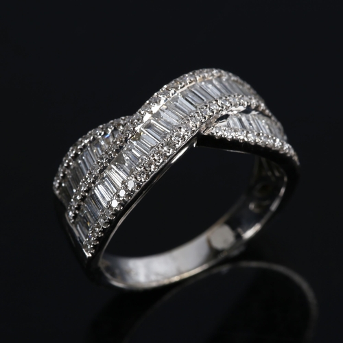 349 - A modern 18ct white gold diamond crossover ring, set with baguette and modern round brilliant-cut di... 