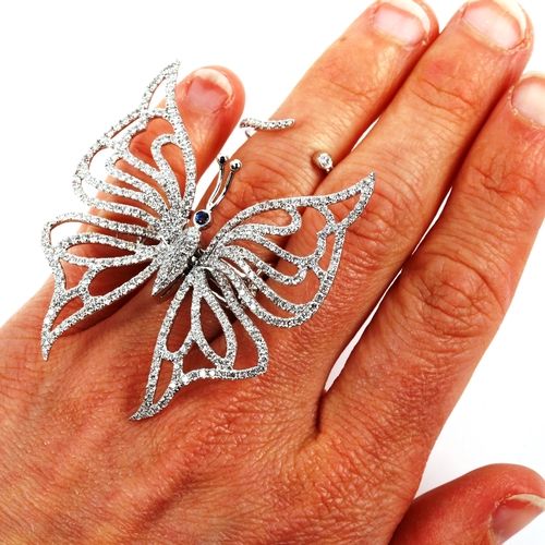 356 - A fine 18ct white gold sapphire and diamond kinetic butterfly ring, in the style of Glenn Spiro, pav... 