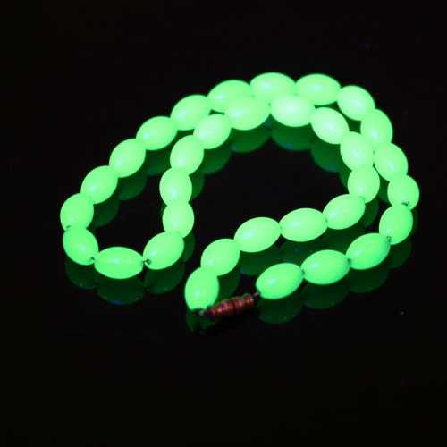 371 - A 1930s uranium glass bead necklace, bead length 12.8mm, necklace length 40cm, 44.8g