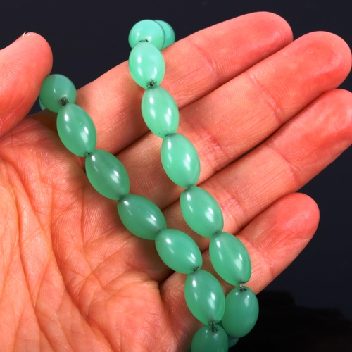 371 - A 1930s uranium glass bead necklace, bead length 12.8mm, necklace length 40cm, 44.8g