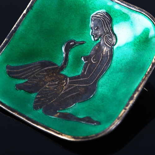 372 - A Scandinavian sterling silver and green enamel Leda and the Swan brooch, concave form, import hallm... 