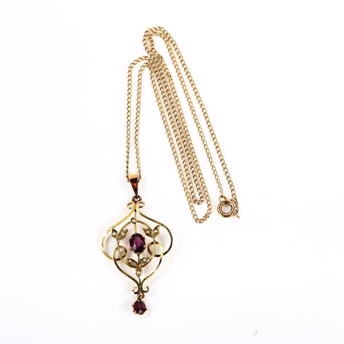 376 - An Edwardian 9ct gold amethyst and pearl openwork pendant necklace, on 9ct fine curb link chain, pen... 