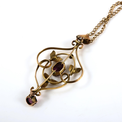 376 - An Edwardian 9ct gold amethyst and pearl openwork pendant necklace, on 9ct fine curb link chain, pen... 