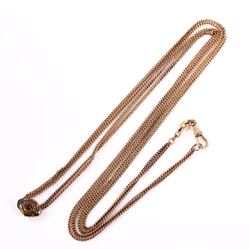 379 - An Antique rose gold plated fine double curb link long guard chain, with stone set slide and dog cli... 