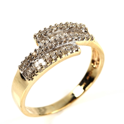 385 - A modern 9ct gold diamond cluster crossover ring, set with baguette and round brilliant-cut diamonds... 