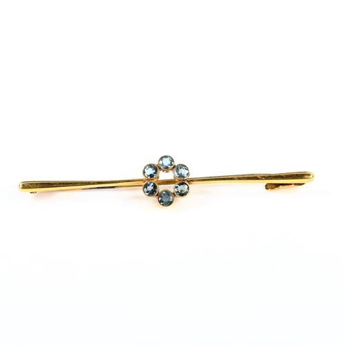 391 - A 15ct gold blue topaz cluster bar brooch, set with round-cut topaz, brooch length 58.8mm, 2.8g