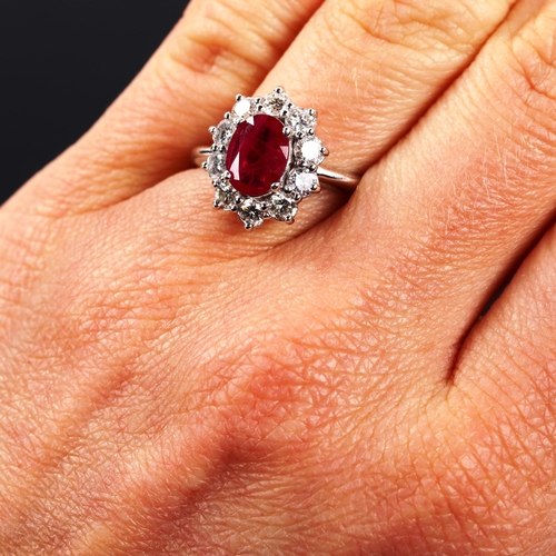 395 - A modern 14ct white gold ruby and diamond oval cluster ring, set with oval mixed-cut ruby and modern... 