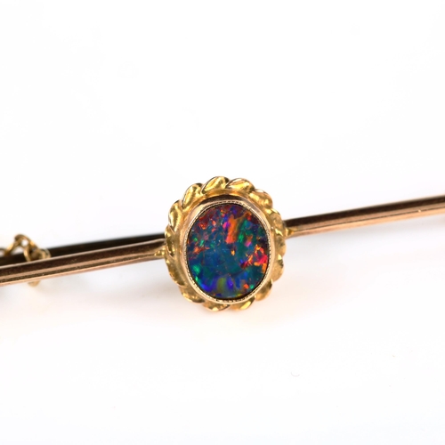 406 - An unmarked gold black opal doublet bar brooch, length 43.4mm, 1.9g