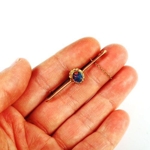 406 - An unmarked gold black opal doublet bar brooch, length 43.4mm, 1.9g