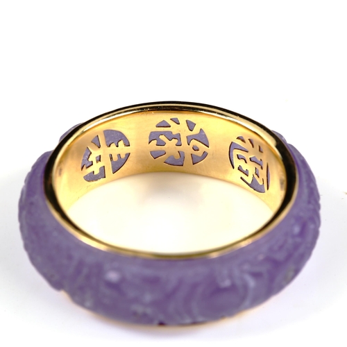 409 - A modern 14ct gold lavender jade band ring, carved dragon decoration with character mark inner shank... 