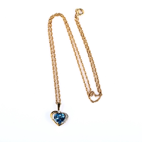 413 - A 9ct gold blue topaz and diamond heart pendant necklace, on 9ct Prince of Wales link chain, pendant... 