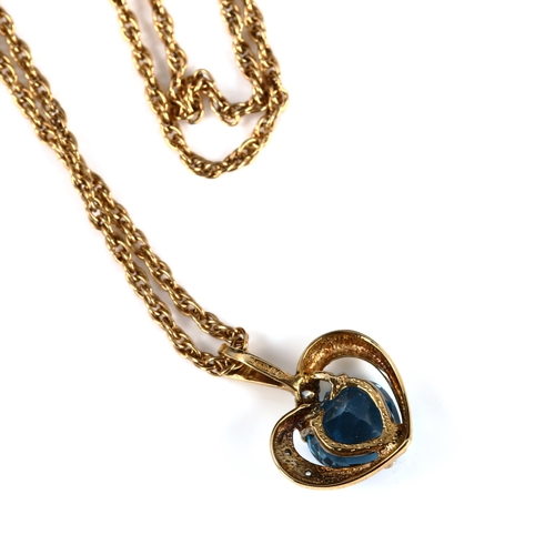 413 - A 9ct gold blue topaz and diamond heart pendant necklace, on 9ct Prince of Wales link chain, pendant... 