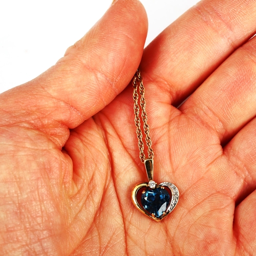 413 - A 9ct gold blue topaz and diamond heart pendant necklace, on 9ct Prince of Wales link chain, pendant... 