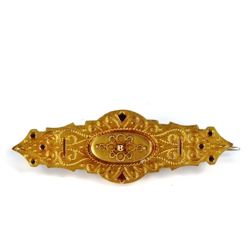 422 - A Victorian 9ct gold Etruscan style memorial brooch, with vacant glass panel back, brooch length 41.... 