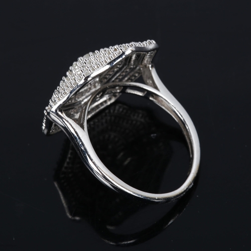 423 - A large modern sterling silver diamond cluster ring, tier set with single and baguette-cut diamonds,... 