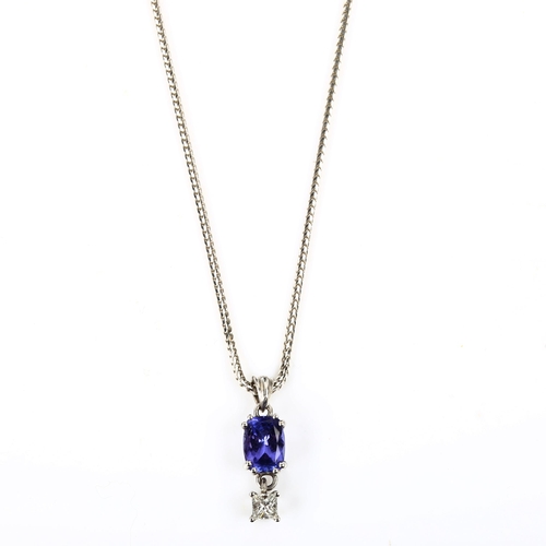 426 - A modern 18ct white gold tanzanite and diamond pendant necklace, set with oval mixed-cut tanzanite a... 