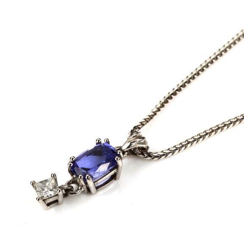 426 - A modern 18ct white gold tanzanite and diamond pendant necklace, set with oval mixed-cut tanzanite a... 