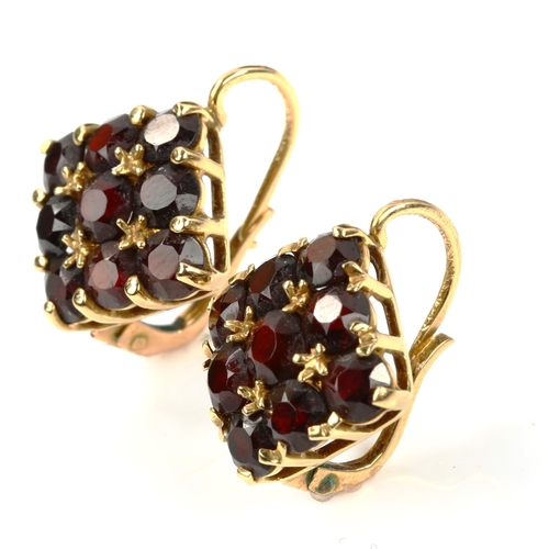 432 - A pair of 18ct gold garnet square cluster earrings, set with round-cut diamonds and English lock fit... 