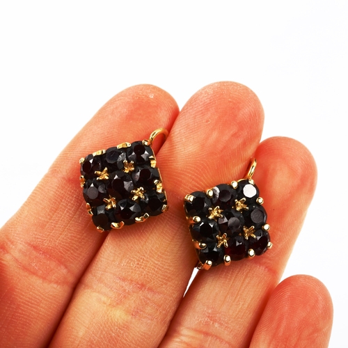 432 - A pair of 18ct gold garnet square cluster earrings, set with round-cut diamonds and English lock fit... 