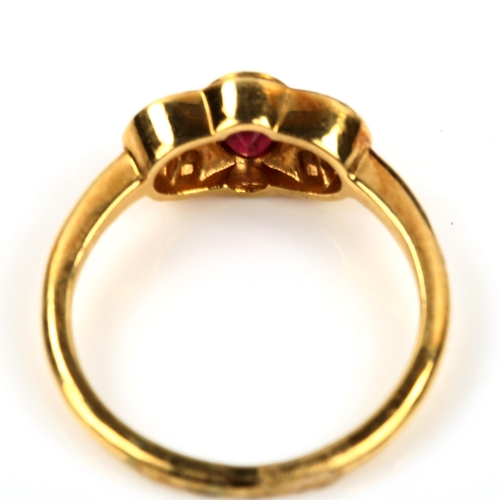 434 - A modern 18ct gold ruby and diamond dress ring, set with oval mixed-cut ruby and round-cut diamonds,... 