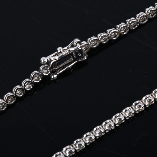 437 - A modern 18ct white gold diamond tennis line bracelet, set with modern round brilliant-cut diamonds,... 