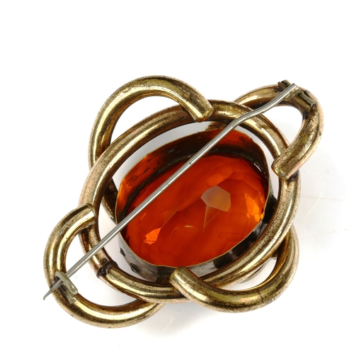 441 - A large Victorian gilt-metal citrine knot brooch, brooch length 61.8mm, 35.7g