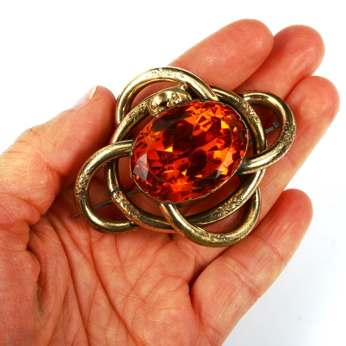 441 - A large Victorian gilt-metal citrine knot brooch, brooch length 61.8mm, 35.7g