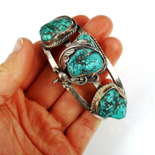 442 - A Native American Navajo sterling silver and turquoise torque bangle, band width 34mm, internal meas... 