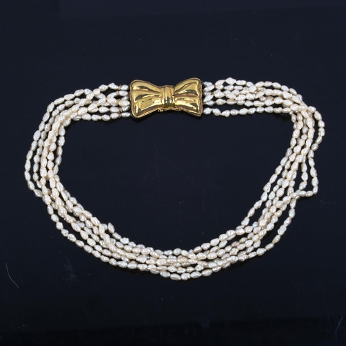 445 - A 1970s 6-strand freshwater pearl necklace, on 18ct gold bow clasp, necklace length 40cm, 54.8g