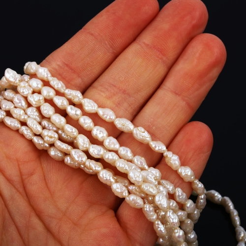 445 - A 1970s 6-strand freshwater pearl necklace, on 18ct gold bow clasp, necklace length 40cm, 54.8g