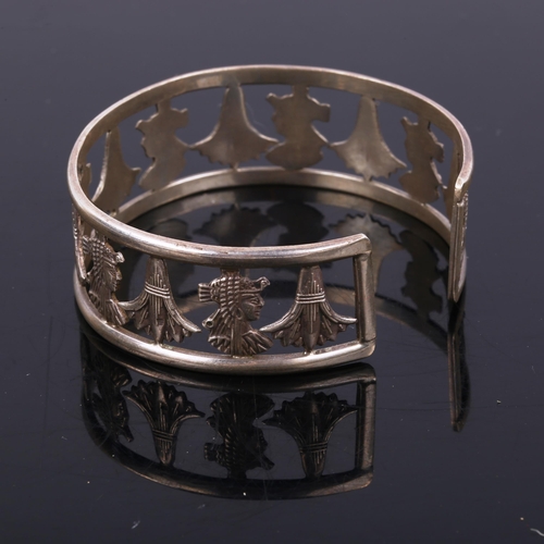 446 - A Continental silver Aztec Revival torque bangle, band width 22.1mm, internal diameter 6cm, 30.2g