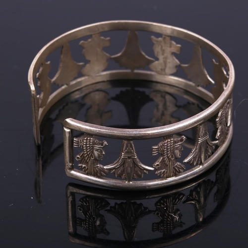 446 - A Continental silver Aztec Revival torque bangle, band width 22.1mm, internal diameter 6cm, 30.2g