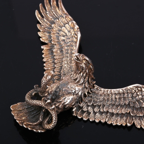 447 - A large unmarked silver articulated eagle and snake pendant, wingspan 11cm, 39.7g