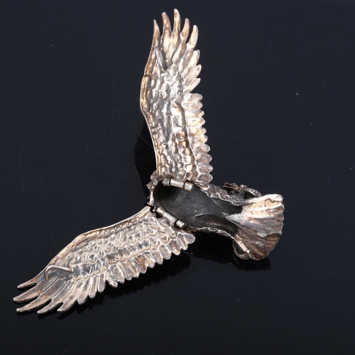 447 - A large unmarked silver articulated eagle and snake pendant, wingspan 11cm, 39.7g