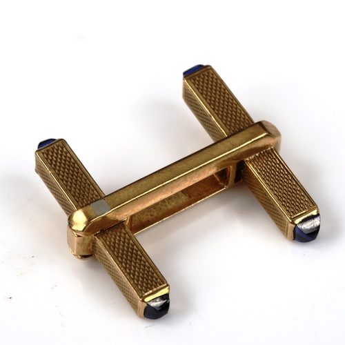 449 - ASPREY - an Art Deco 9ct gold sapphire single cufflink, allover engine turned decoration with pyrami... 