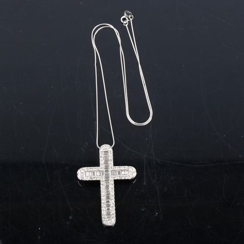 453 - A large modern 18ct white gold diamond cross pendant necklace, set with baguette and modern round br... 