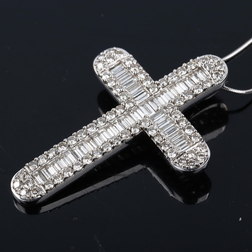 453 - A large modern 18ct white gold diamond cross pendant necklace, set with baguette and modern round br... 