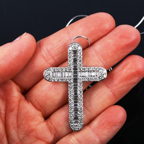 453 - A large modern 18ct white gold diamond cross pendant necklace, set with baguette and modern round br... 