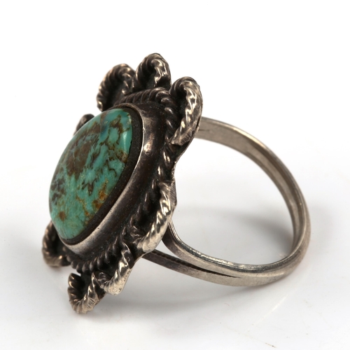 456 - A Native American Navajo unmarked silver and turquoise ring, setting height 30.5mm, size O, 7.4g