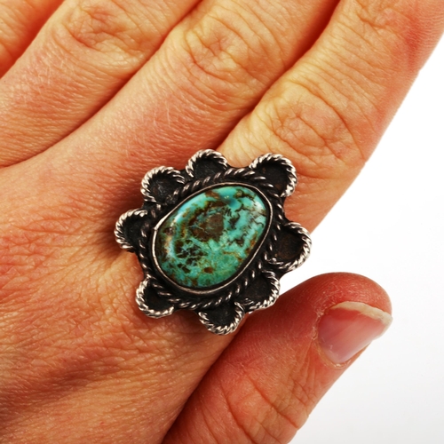 456 - A Native American Navajo unmarked silver and turquoise ring, setting height 30.5mm, size O, 7.4g