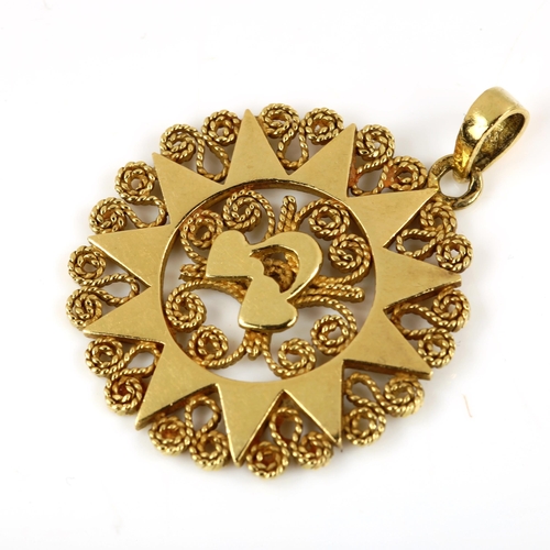 461 - A Continental unmarked gold sun pendant, pendant diameter 28.1mm, 6g