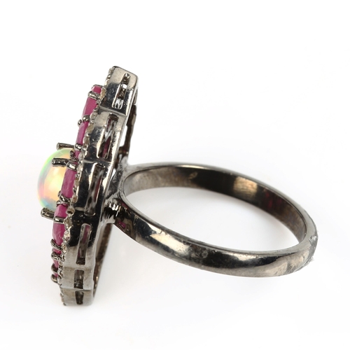 471 - A modern oxidised sterling silver opal ruby and diamond cluster panel ring, total diamond content ap... 