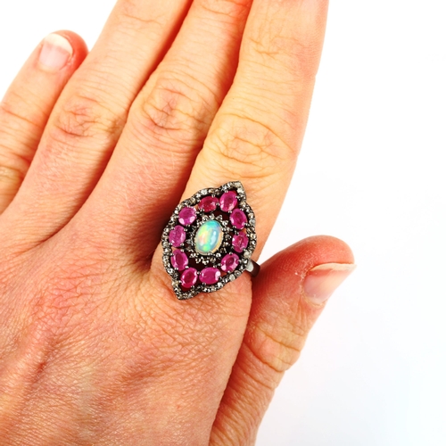 471 - A modern oxidised sterling silver opal ruby and diamond cluster panel ring, total diamond content ap... 