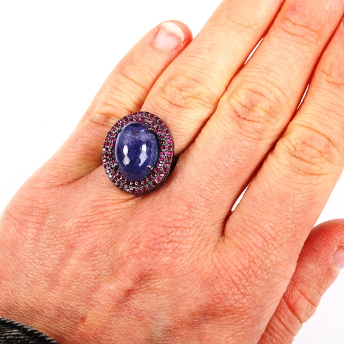 472 - A modern oxidised sterling silver tanzanite and ruby oval cluster ring, set with high oval cabochon ... 