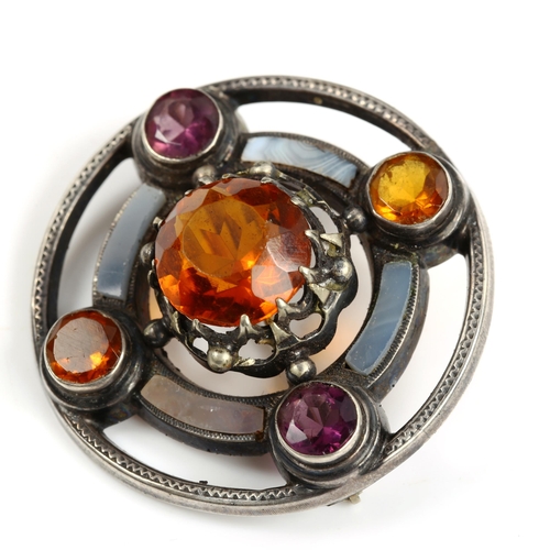 473 - A Scottish unmarked silver stone set targe shield target brooch, set with citrine amethyst and agate... 