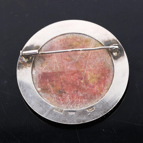 480 - A Russian silver tugtupite brooch, stamped with maker's mark, brooch diameter 46mm, 21.7g