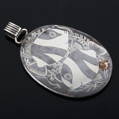 486 - GEORG JENSEN - a Danish iron and silver fish pendant, designed by Arno Malinowski, model no. 5025, p... 