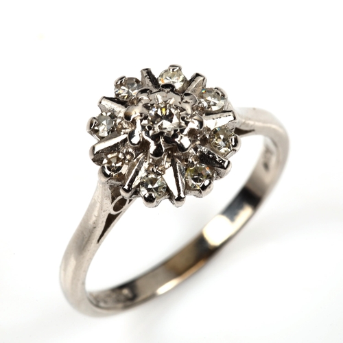 487 - An 18ct white gold diamond cluster flowerhead ring, total diamond content approx 0.2ct, setting heig... 