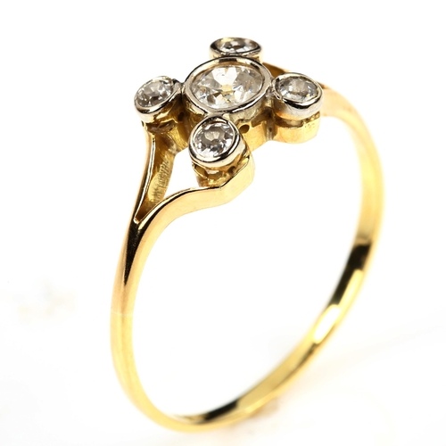 491 - An early 20th century 18ct gold five stone diamond cross ring, set with round old-cut diamonds, tota... 